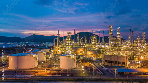 Fotografija Aerial view oil and gas storage chemical tank with oil refinery petrochemical construction architecture plant background at twilight
