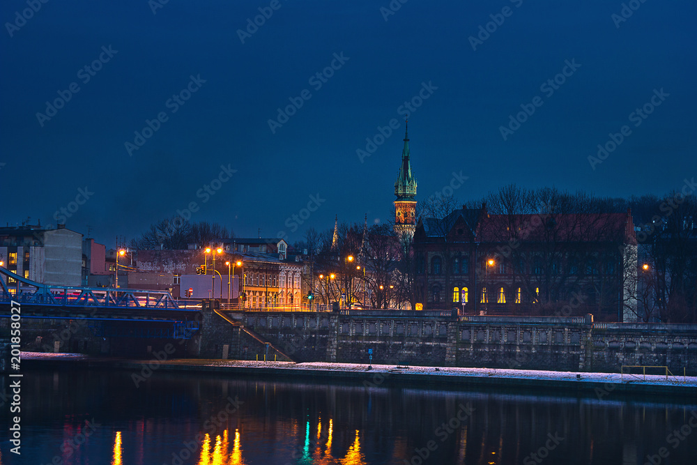 Krakow cityscape. Night lights over the Vistula