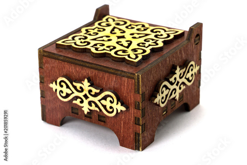 Wooden brown box with a pattern of Central Asia photo