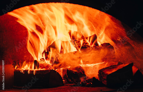 Fire background. Beautiful Fire Close-Up. Video. Burning Firewood in the Fireplace. Firewood Burn in the wood burning stove