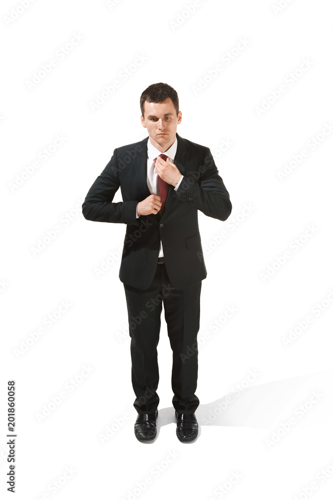 Above front portrait of a businessman with very serious face. Confident professional with piercing look in the foreground of the camera. Above front portrait of a businessman with very serious face. Confident professional with piercing look in the foreground of the camera.