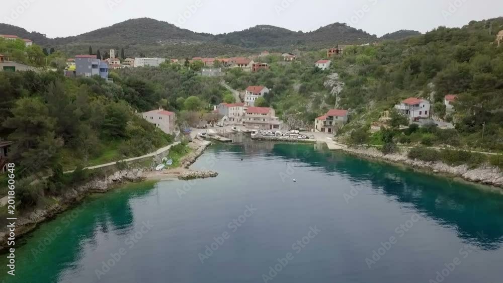 Aerial: Going up filming while flying over small blue bay in Croatia. Filmed on sailing trip in Croatia on beautiful blue Adriatic sea. Aerial: Going up filming while flying over small blue bay in Croatia. Filmed on sailing trip in Croatia on beautiful blue Adriatic sea.