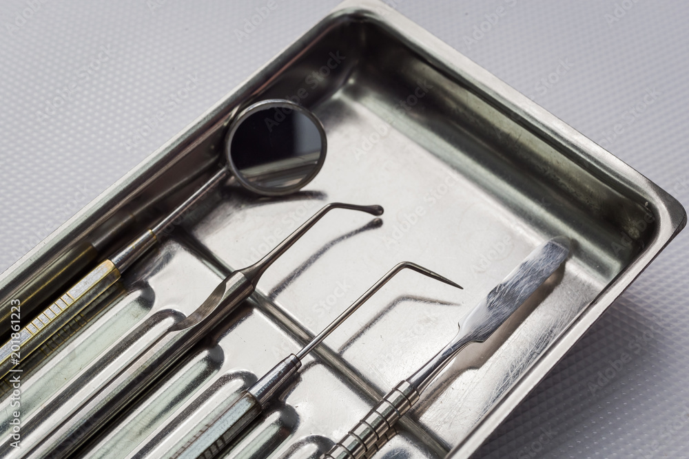 dental tools on white background top view. Stomatology dental tools on white background top view. Stomatology