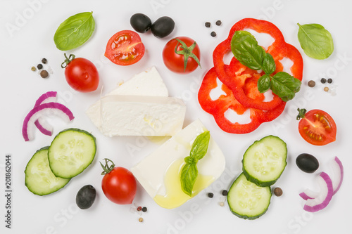 Healthy eating concept - selection of greek salad ingredients on white background