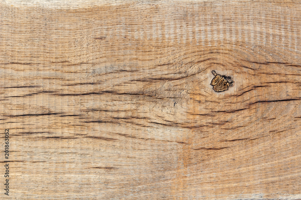 Texture of an old weathered wooden board closeup. Natural wood background Texture of an old weathered wooden board closeup. Natural wood background