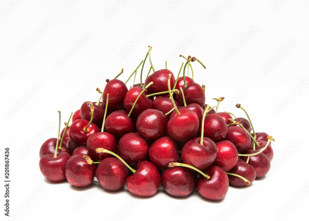 Gorgeous Ruby Red Cherries Stacked on a White Background Gorgeous Ruby Red Cherries Stacked on a White Background