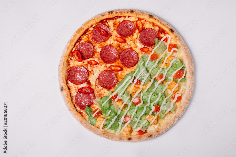 Pizza with salami and chicken isolated on white. Top view Pizza with salami and chicken isolated on white. Top view