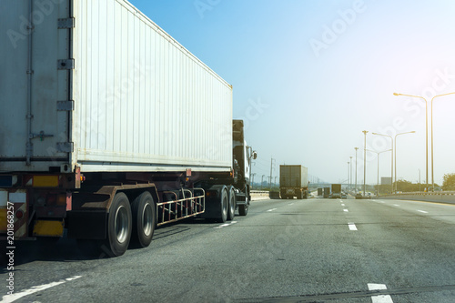 Truck on highway road with container, transportation concept.,import,export logistic industrial Transporting Land transport on asphalt expressway.with blue sky