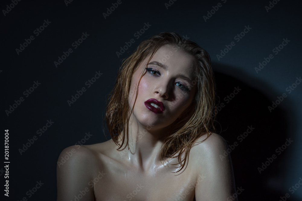 Dramatic portrait of a beautiful girl background in studio Dramatic portrait of a beautiful girl background in studio