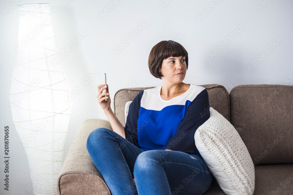 nice young woman at home with mobile phone nice young woman at home with mobile phone