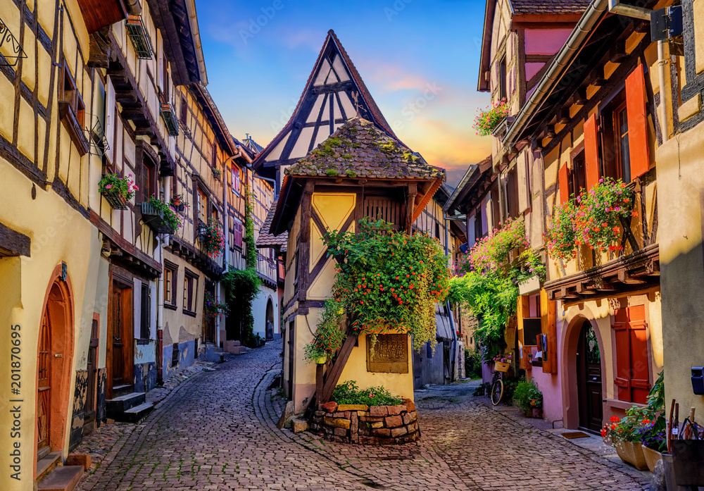 Colorful half-timbered houses in Eguisheim, Alsace, France - obrazy, fototapety, plakaty 