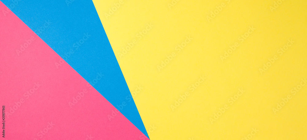 Color papers geometry flat composition background with yellow, pink and blue tones