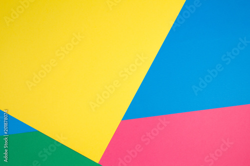 Color papers geometry flat composition background with yellow  green  red and blue tones