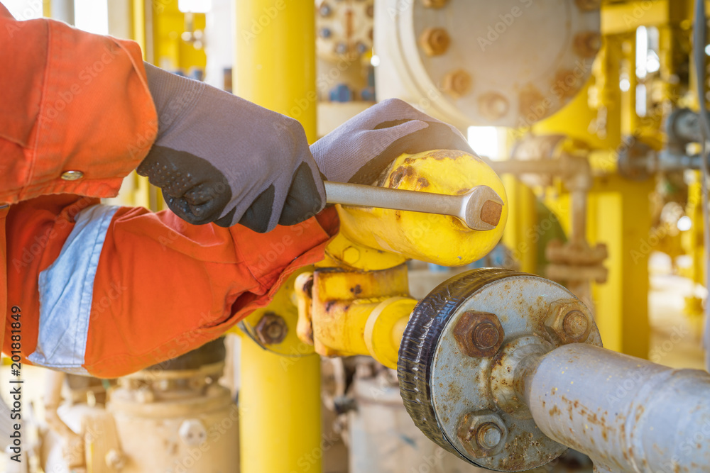 The production operator adjusting pressure regulator of instrument gas