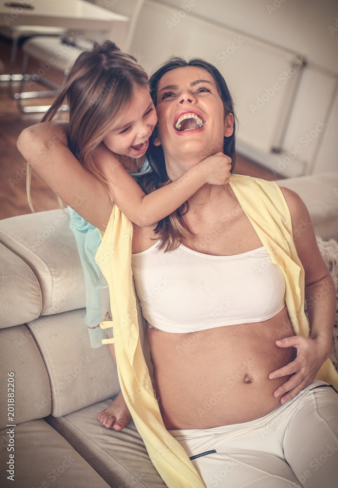 Portrait happy mother and daughter spending time together. Portrait happy mother and daughter spending time together.