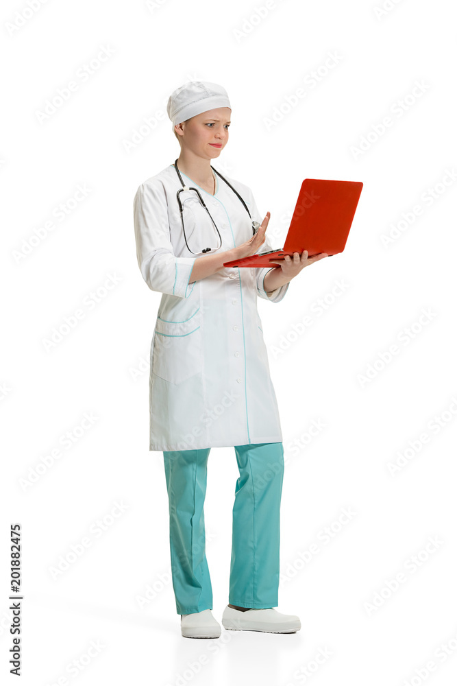 Beautiful young woman in white coat posing at studio. Full length studio shot isolated on white. Beautiful young woman in white coat posing at studio. Full length studio shot isolated on white.