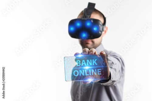 Business, Technology, Internet and network concept. Young businessman working in virtual reality glasses sees the inscription: Bank online