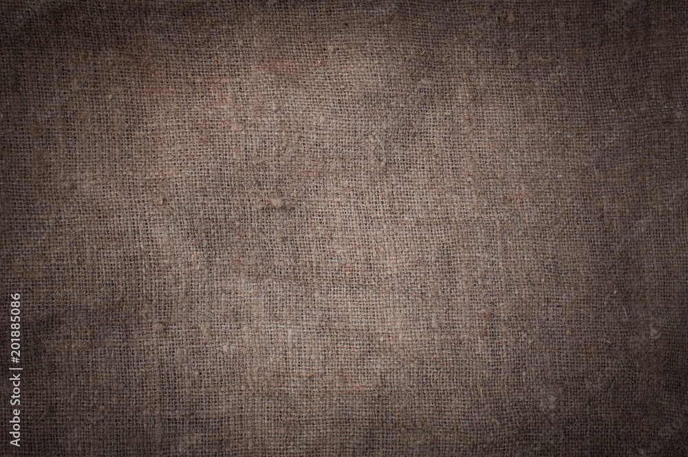 Old stained brown horizontal creasy burlap texture. Old stained brown horizontal creasy burlap texture.