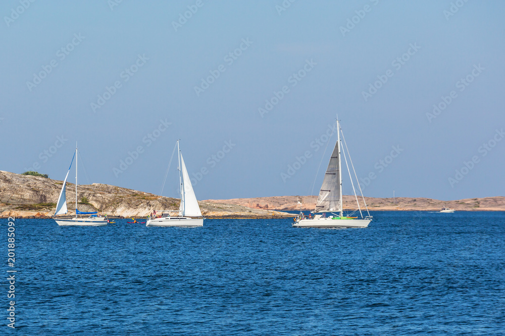 Fototapeta premium Sailboats at rocky archipelago