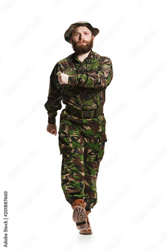 Young army soldier wearing camouflage uniform isolated on white Young army soldier wearing camouflage uniform isolated on white