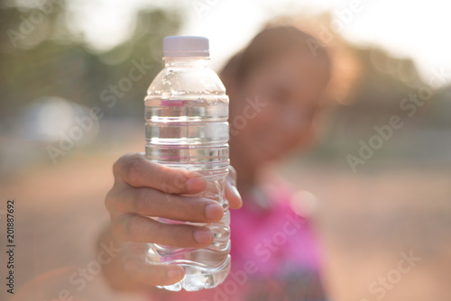 woman hold drinking  water in her hand 