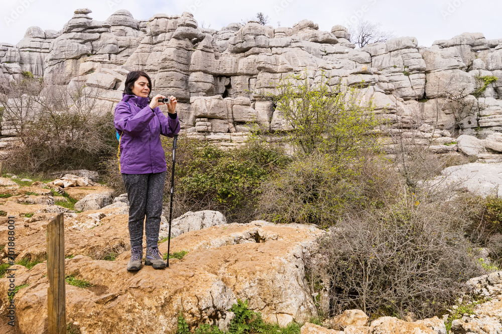 Hiker woman walking in mountains , Torcal in Antequera city  , Spain