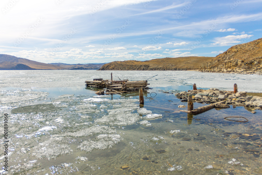 Lake Baikal in spring. old berth view of the ice drift in the small sea from the coastal rocks Lake Baikal in spring. old berth view of the ice drift in the small sea from the coastal rocks