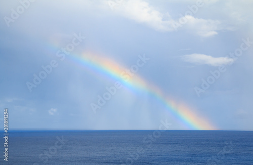 rainbow over the horizone at sea © van_sinsy