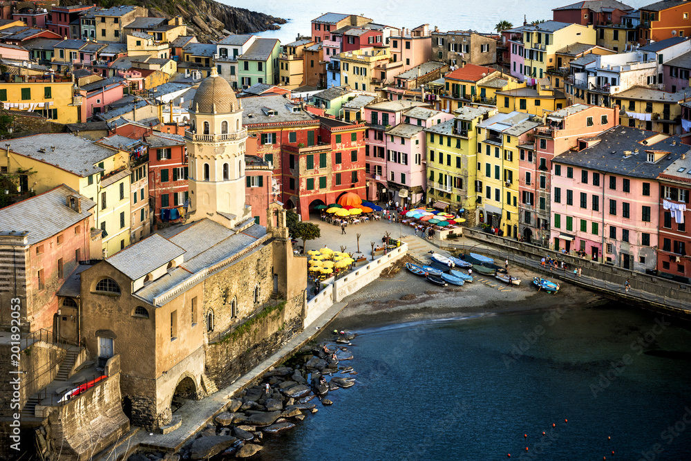 Vernazza fisherman village at sunset. Vernazza is one of five famous colorful villages of Cinque Terre in Italy, suspended between sea and land on sheer cliffs. Liguria, Italy