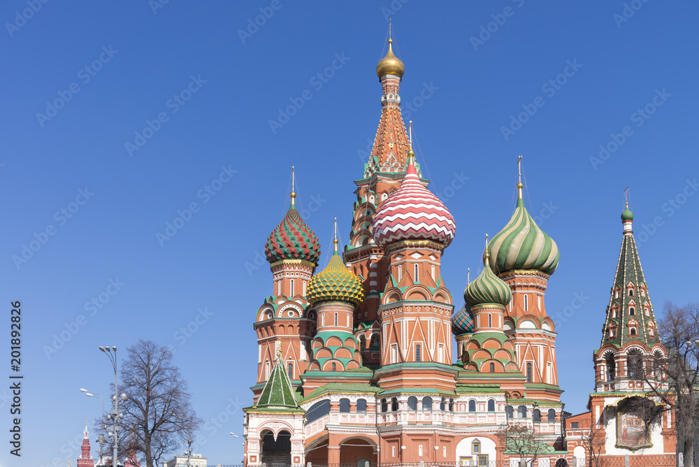 Moscow,Russia, St. Basil's Cathedral and Kremlin Walls and Tower in Red square in sunny blue sky. Red square is Attractions popular's touris in russia