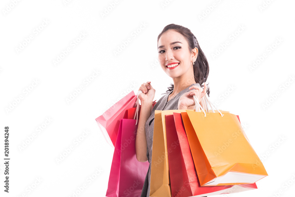 Happy Attractive Asian Woman smile and enjoy with shopping bags isolated on white background,Shopping Concept