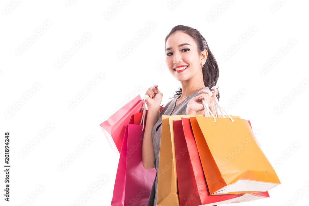 Happy Attractive Asian Woman smile and enjoy with shopping bags isolated on white background,Shopping Concept Happy Attractive Asian Woman smile and enjoy with shopping bags isolated on white background,Shopping Concept