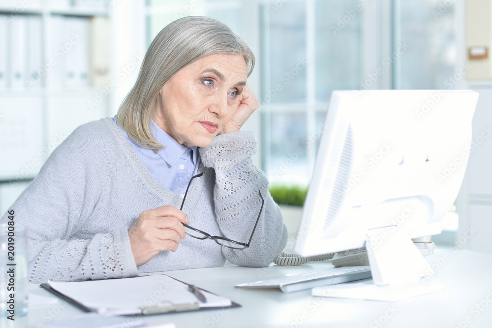 senior woman working with computer senior woman working with computer