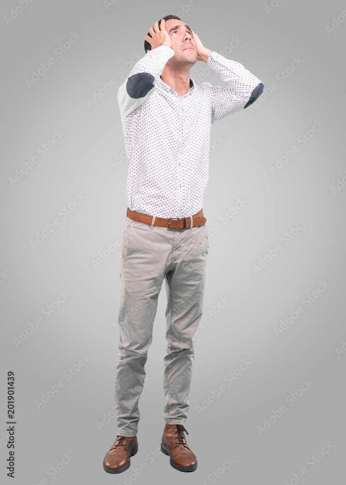 Tired young man with a gesture of stress - Full body shot Tired young man with a gesture of stress - Full body shot