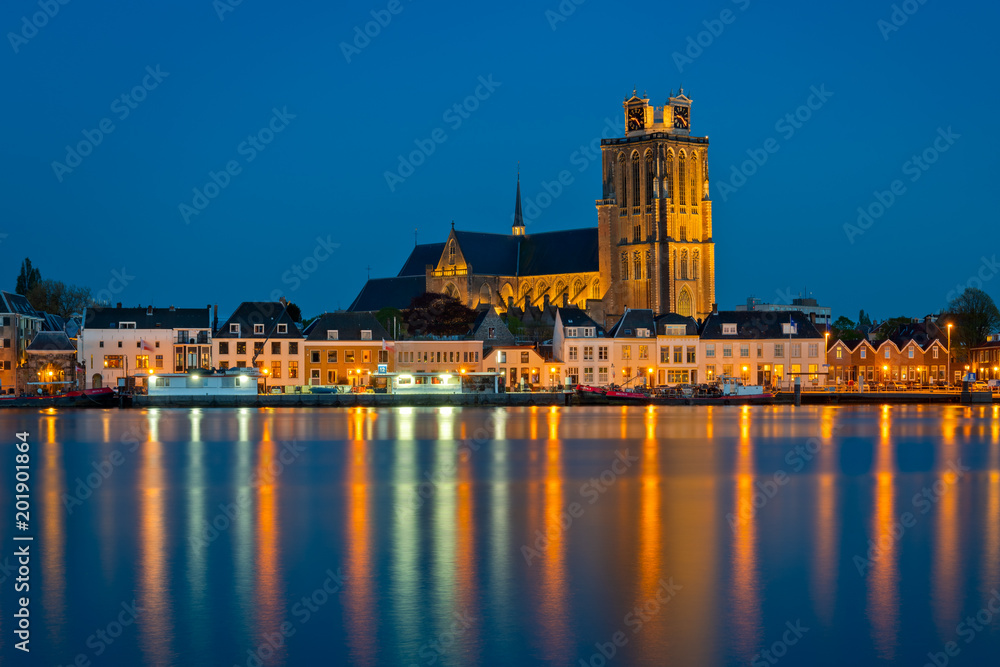 View on the old church of Dordrecht city in the Netherlands.
Photo is taken at the opposite riverbank during the blue hour with the city in the beautiful lights.