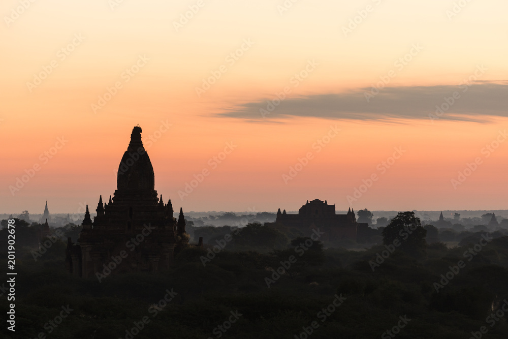 Silhouette of the ancient temples in the archaeological park in Bagan before the sunrise, Myanmar