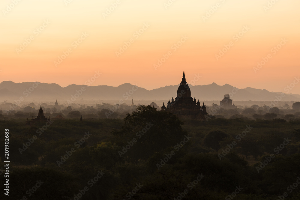 Silhouette of the ancient temples in the archaeological park in Bagan before the sunrise, Myanmar