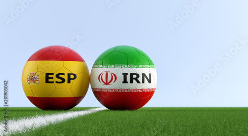 Spain vs. Iran Soccer Match - Soccer balls in Spain and Iran national colors on a soccer field. Copy space on the right side - 3D Rendering 