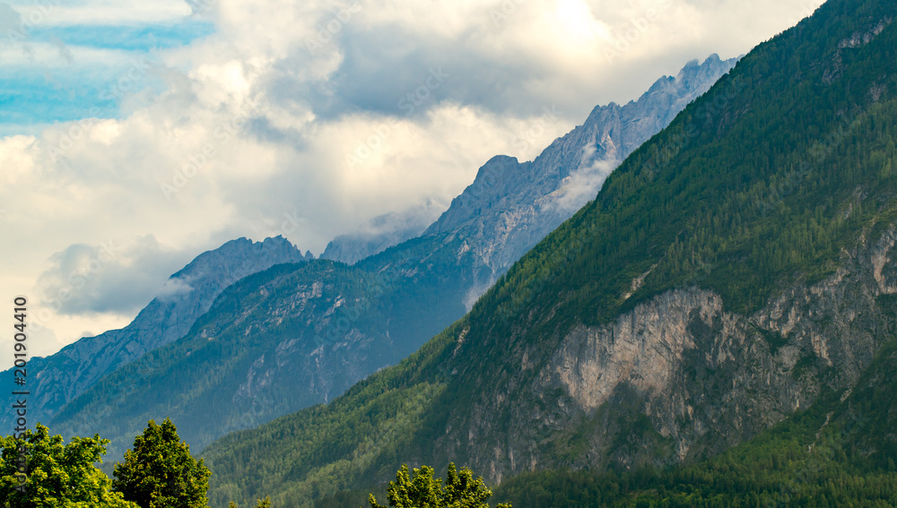 Fototapeta premium The Alps of Austria stand as a testament to nature's grandeur, with mighty mountains that have captivated the hearts of adventurers and nature
