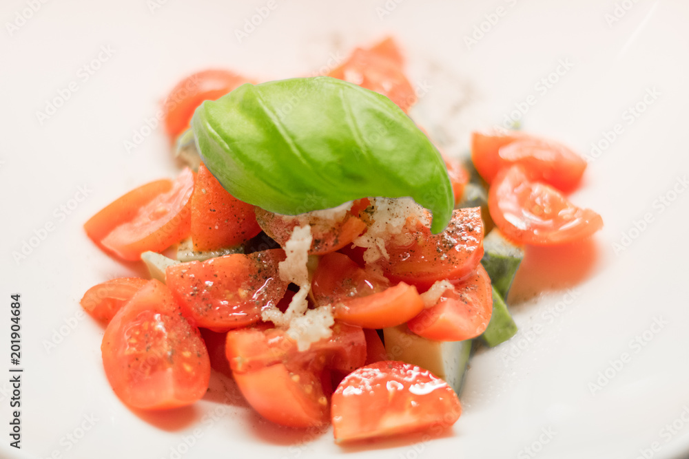 Fresh salad. Basil, tomatoes, garlic Fresh salad. Basil, tomatoes, garlic