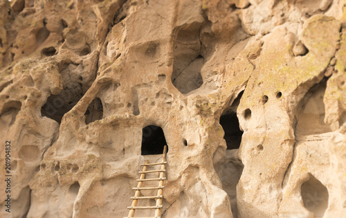 Native American cliff dwelling caves with access ladder at Bandelier National Monument, New Mexico, USA. photo