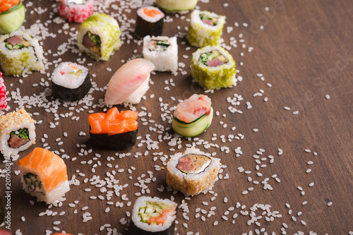 Assortment of colorful sushi and rolls background