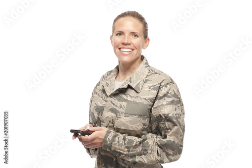Tela Portrait of female airman with mobile phone