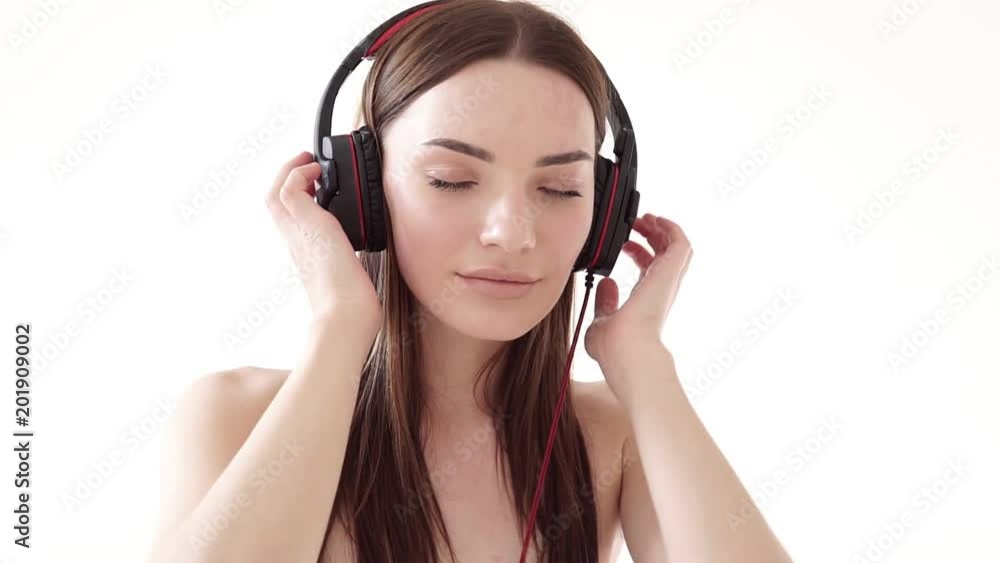 Portrait of a woman with big headphones with music Portrait of a woman with big headphones with music