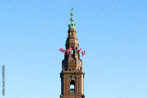Danish flags on the tower. Christiansborg castle, Copenhagen, Denmark.
