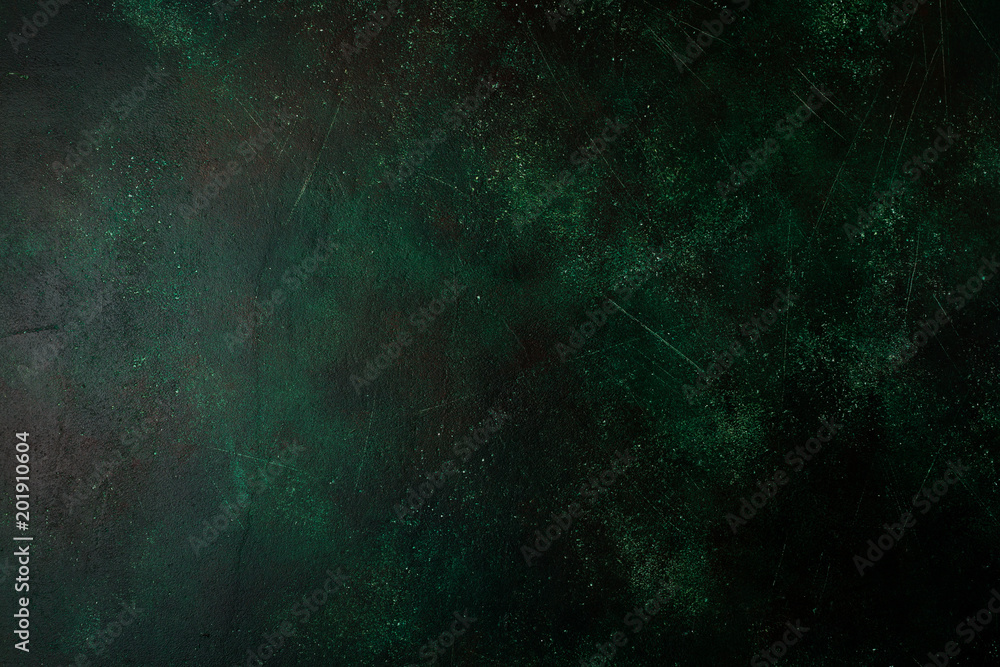 Dark green stone or slate wall. Grunge texture background. Dark green stone or slate wall. Grunge texture background.