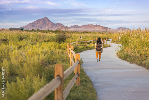 Canvas Print A woman walkimg on the trail in Wetlands park Las Vegas