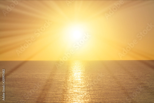 Rays of the sun at sunrise over the sea