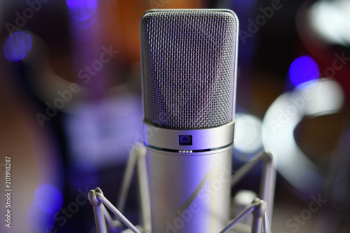 "Take Five" ubiquitous and renowned studio condenser microphone in studio with vibration shock mount unretouched photo