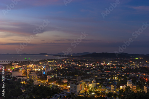 Aerial night scape view of Duong Dong town on Phu Quoc Island in Vietnam, streets with lights and bay